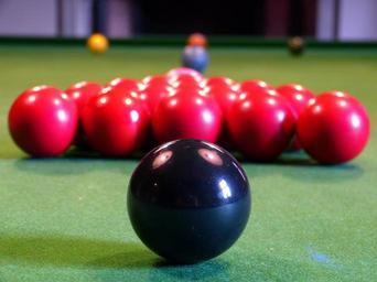 Billiard balls that can help show how the probability of dependent events formula can work.